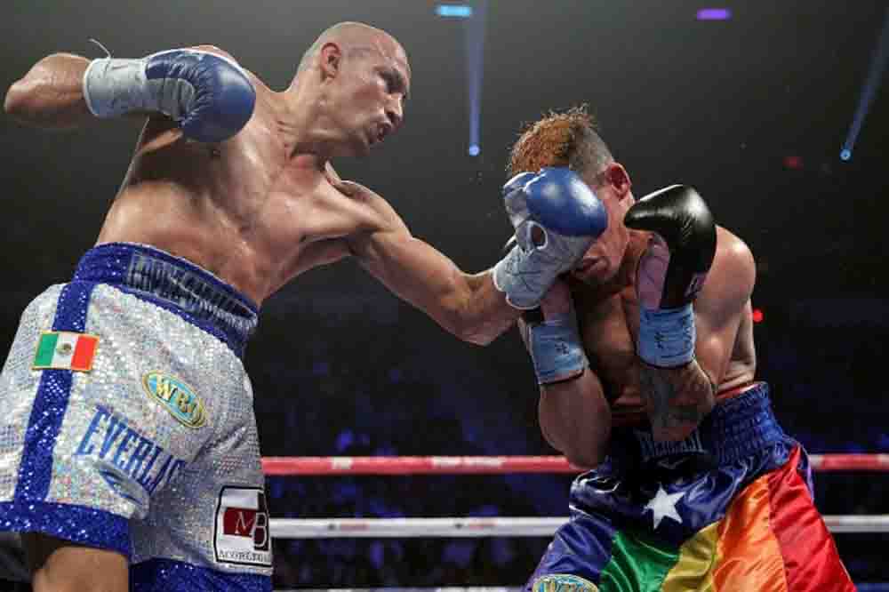 Oct 12, 2013,Las Vegas,Nevada ---  Oct 12, 2013,Las Vegas,Nevada ---    Orlando Salido(L) knocks out Orlando Cruz, Saturday at the Thomas & Mack Center in Las Vegas,Nevada.  --- Photo Credit : Chris Farina - Top Rank (no other credit allowed) copyright 2013