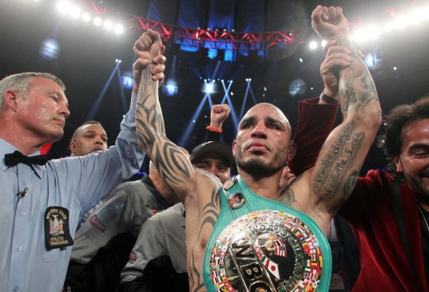 June 7, 2014, New York,NY   ---   Three-time world champion Miguel Cotto of Puerto Rico stops WBC World Middleweight champion Sergio Martinez in the 10th round,  Saturday at Madison Square Garden in New York City.    ----Photo credit : Chris Farina - Top Rank