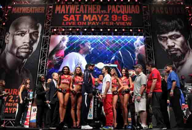 May 1 , 2015, Las Vegas,Nevada  ---  Superstar Manny Pacquiao and  and Floyd Mayweather weigh in (145   146)  for their upcoming historic 12-round welterweight world championship unification mega-fight.          Promoted by Mayweather Promotions and Top Rank Inc. , this pay-per-view telecast will be co-produced and co-distributed by HBO Pay-Per-View® and SHOWTIME PPV® Saturday, May 2 beginning at 9:00 p.m. ET/ 6:00 p.m. PT from the MGM Grand Garden Arena in Las Vegas.     ---   Photo Credit : Chris Farina - Top Rank (no other credit allowed)  copyright 2015